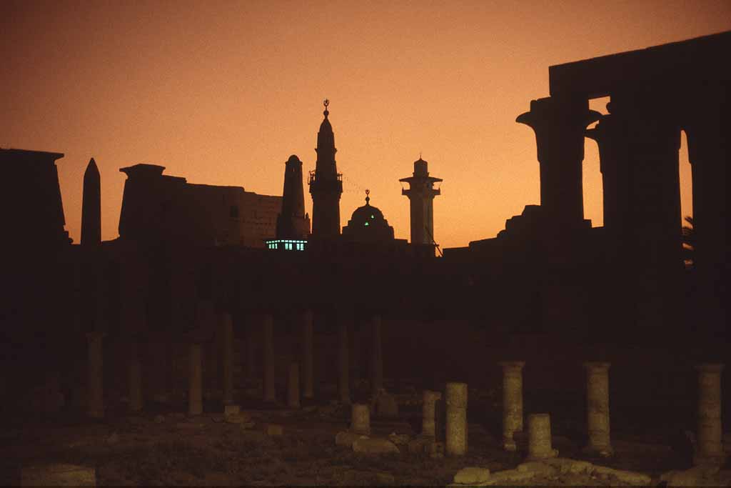 Tor Eigeland - Luxor Temple and silhouetted mosques and minarets. Lights are from a minaret. W0829