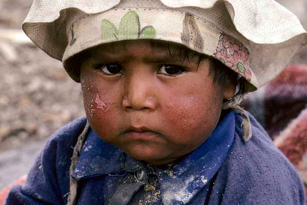 Tor Eigeland - Sierra Tarahumara Indian boy is Juanito. A bit disgruntled in his two hats