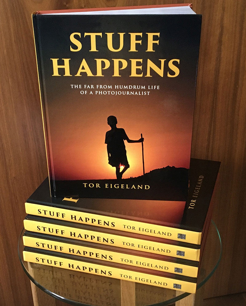 Stuff Happens by Tor Eigeland, stack of books
